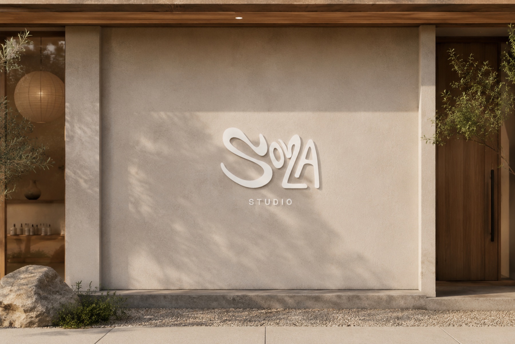 SOLA Studio wordmark on a yoga studio wall